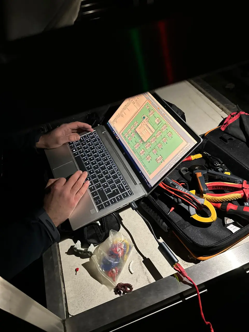 OD Controls engineer on a live fault-find — laptop on Trend 963